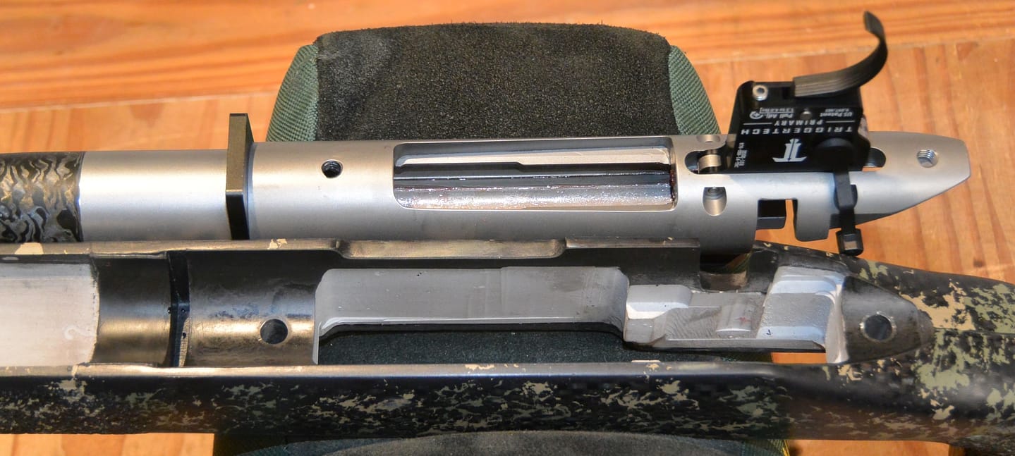 Bedding detail of Mesa Precision Arms Crux Ti in McMillan Adjustable Game Warden Edge Carbon stock