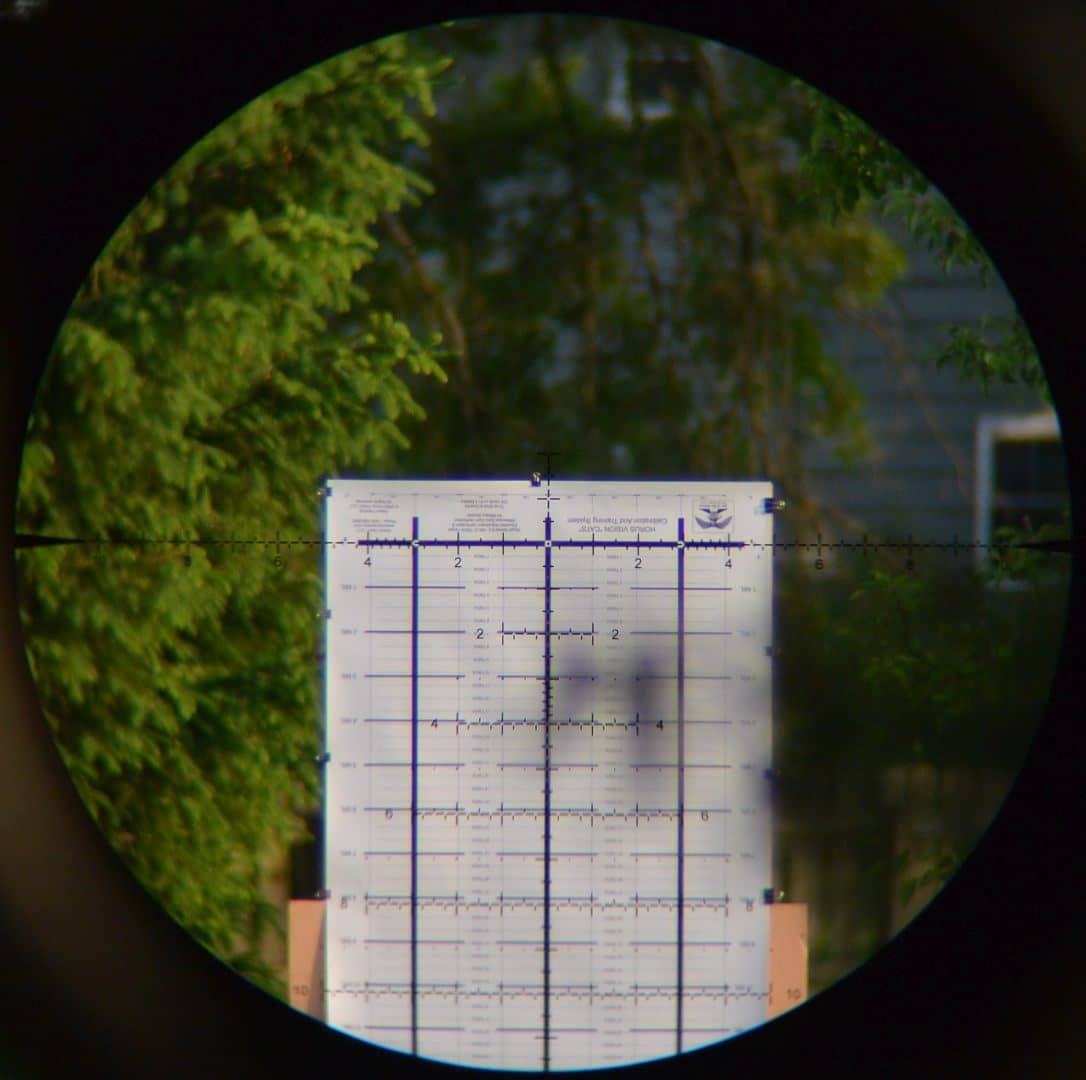 Horus CATS test target though the Leupold Mark 5HD 5-25x56 scope with annoying tree branch in foreground