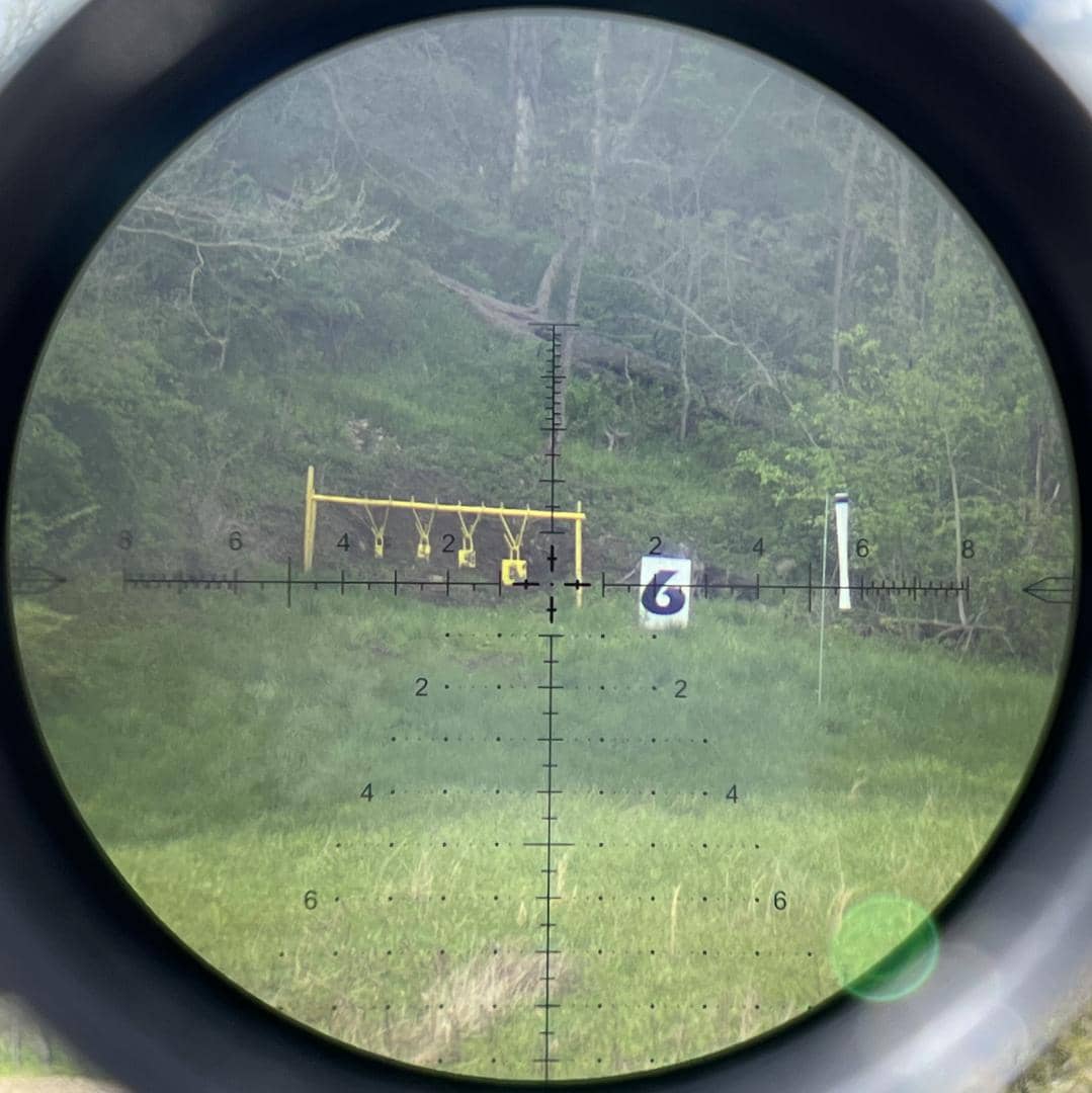 A steel plate through the Arken EP-5 5-25x56 with MIL VPR reticle