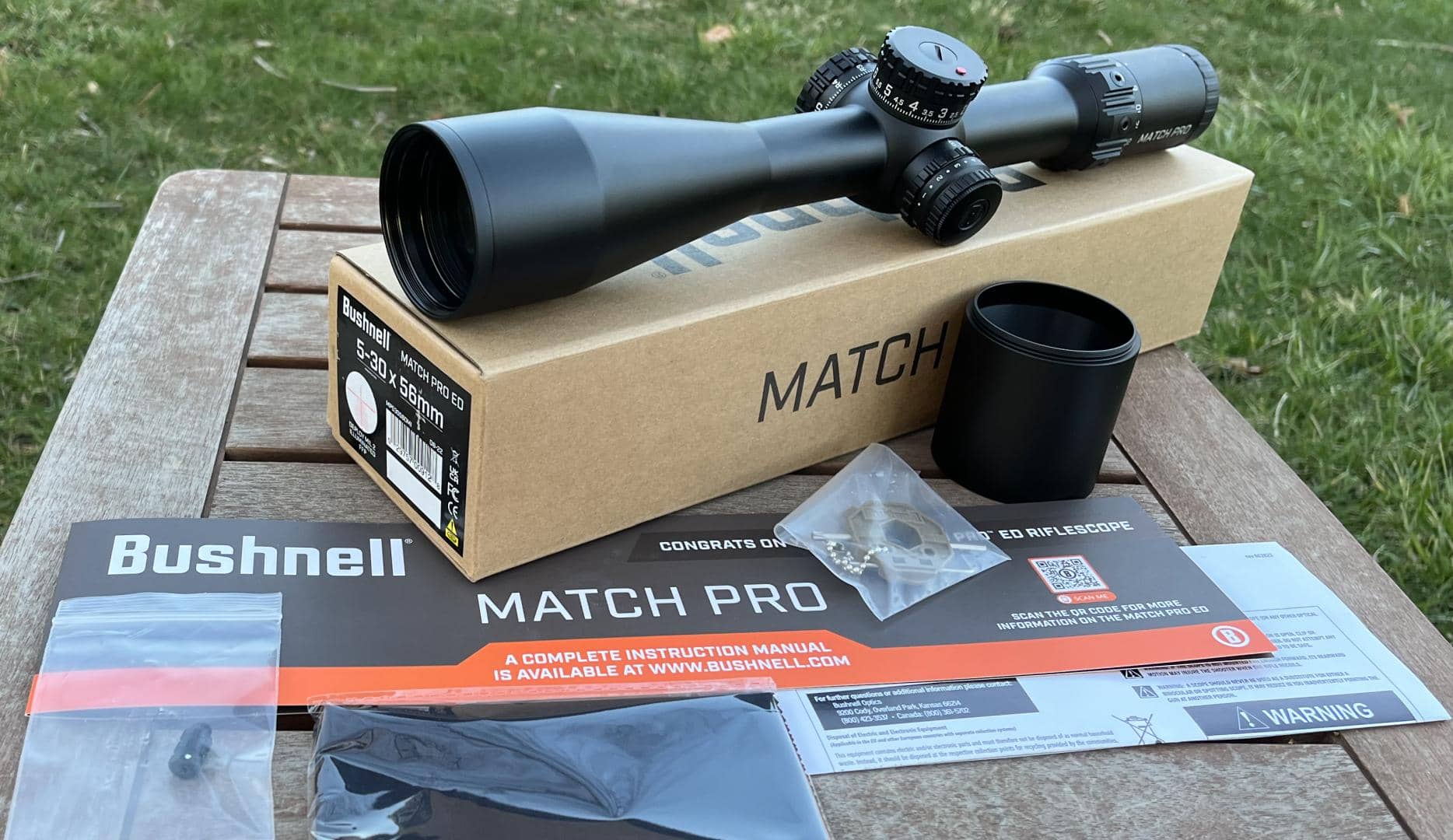 Bushnell Match Pro ED 5-30x56mm unboxing. Extras included with the scope are a short sunshade, lens cloth, keychain tool, and removable throw lever.